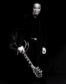 Photo of Sonny Greenwich with his guitar